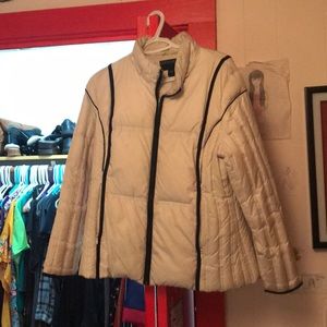 A white girl’s winter coat with insulated lining.